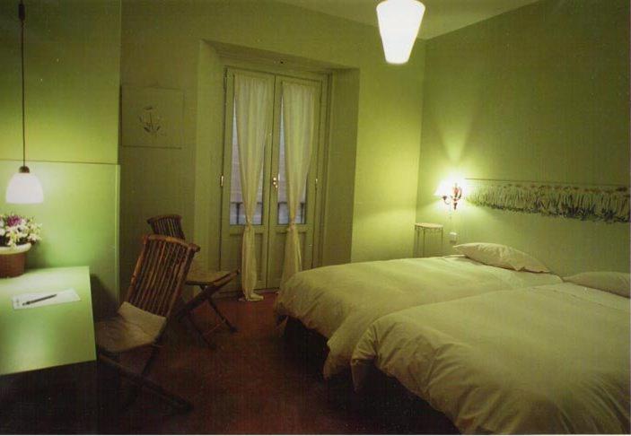 Posteľ alebo postele v izbe v ubytovaní Hostal Fornos
