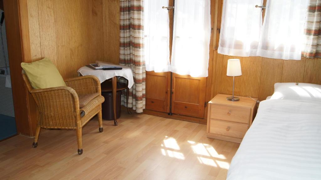 Postel nebo postele na pokoji v ubytování Hotel Alpina