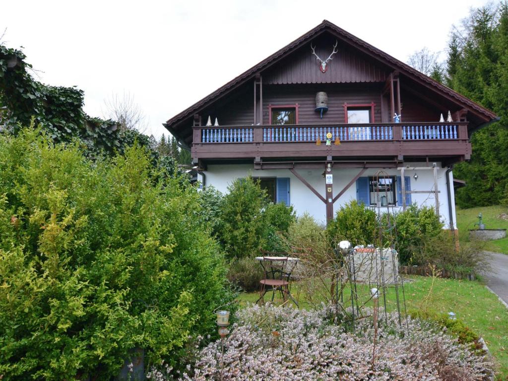 a house with a balcony on top of it at Holiday home in Saldenburg with sauna in Saldenburg