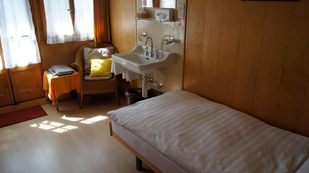 Postel nebo postele na pokoji v ubytování Hotel Alpina