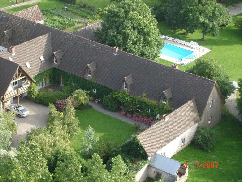 an aerial view of a house with a swimming pool at Cosy flat with pool in Quend Plage les Pins in Quend