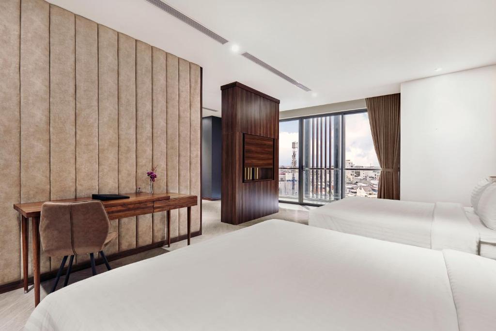 Postel nebo postele na pokoji v ubytování CHAU KHUONG HOTEL