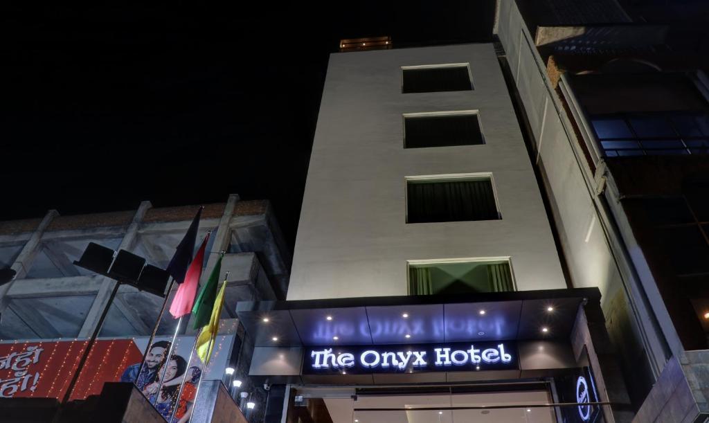 a building with a sign that reads the only hotel at The Onyx Hotel in Jamshedpur