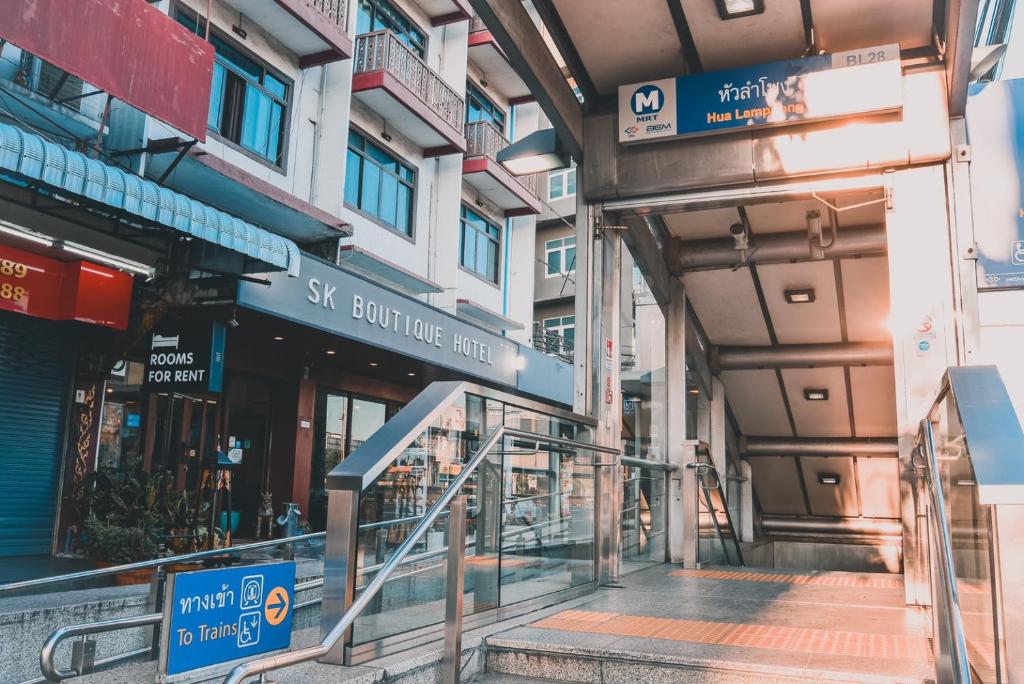 an entrance to a building with escalators in front of it at SK Boutique Mahanakhon in Bangkok