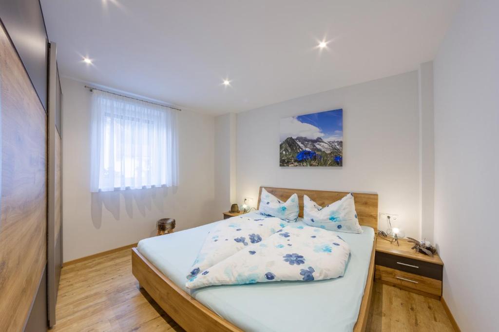 Postel nebo postele na pokoji v ubytování Apartments Hubertus bei Meran