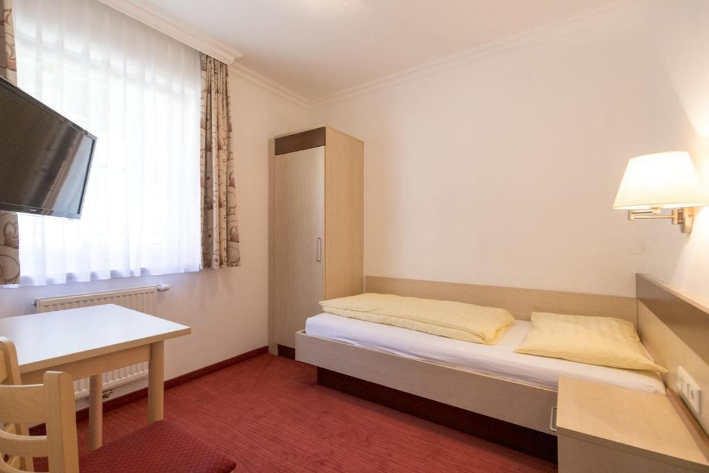 Postel nebo postele na pokoji v ubytování Hotel-Restaurant Planaihof