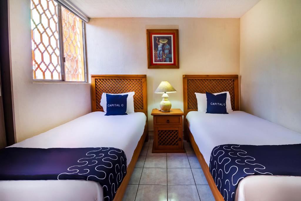 Postel nebo postele na pokoji v ubytování Suites Navata