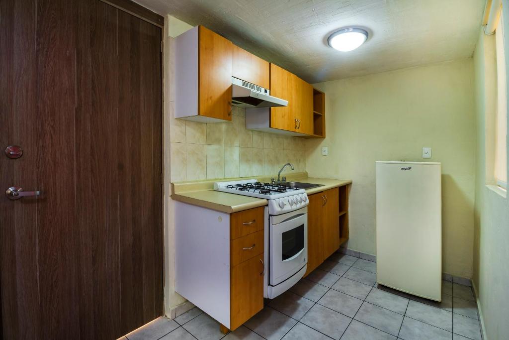 Kuchyň nebo kuchyňský kout v ubytování Suites Navata