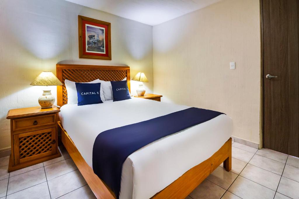 Postel nebo postele na pokoji v ubytování Suites Navata