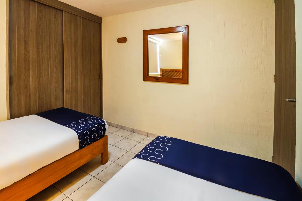 Postel nebo postele na pokoji v ubytování Suites Navata
