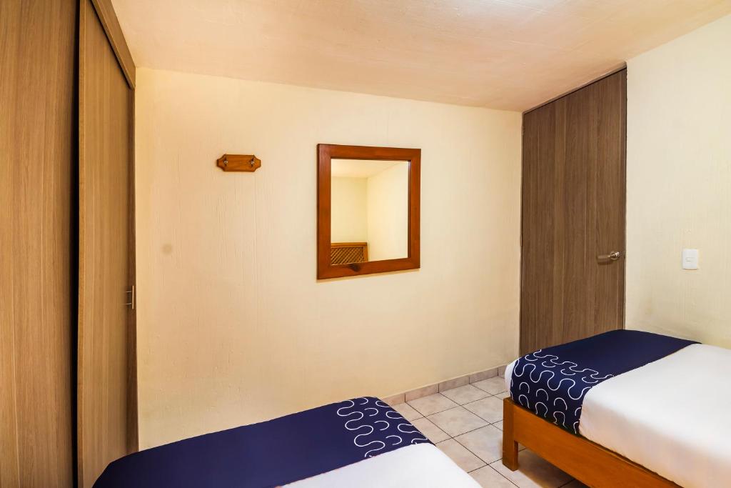 Postel nebo postele na pokoji v ubytování Suites Navata
