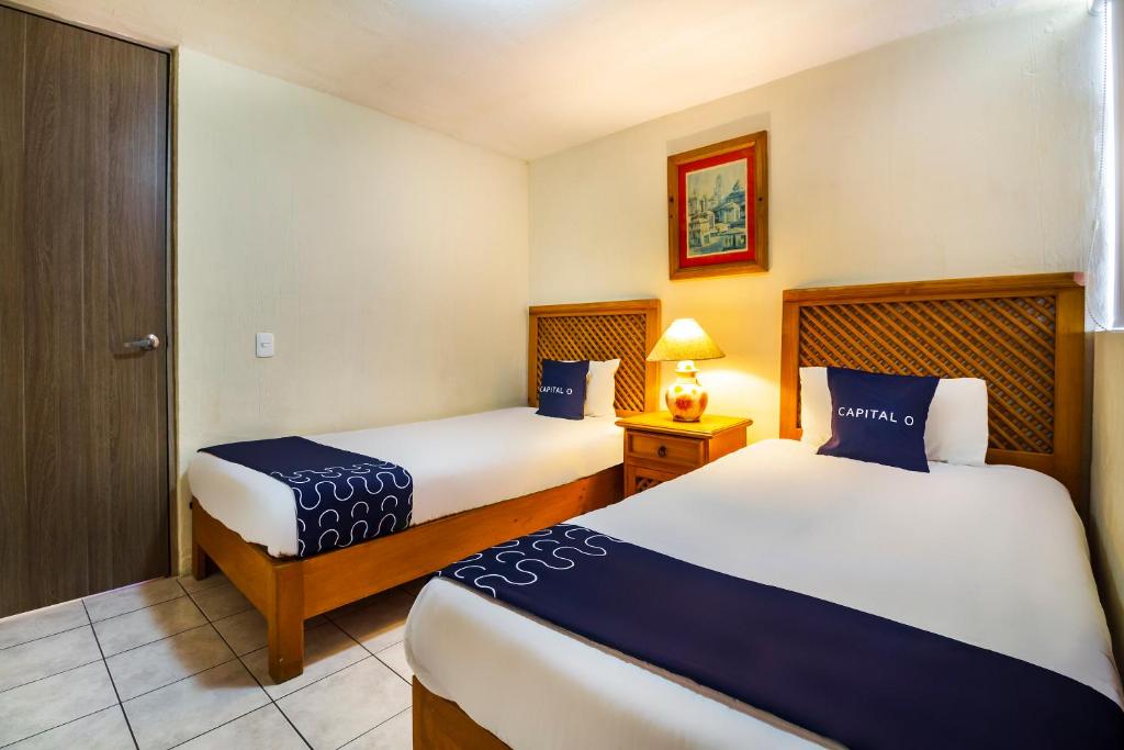 Postel nebo postele na pokoji v ubytování Suites Navata