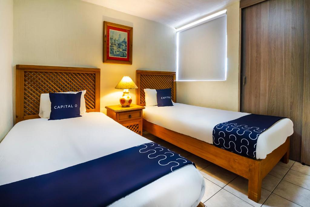 Postel nebo postele na pokoji v ubytování Suites Navata