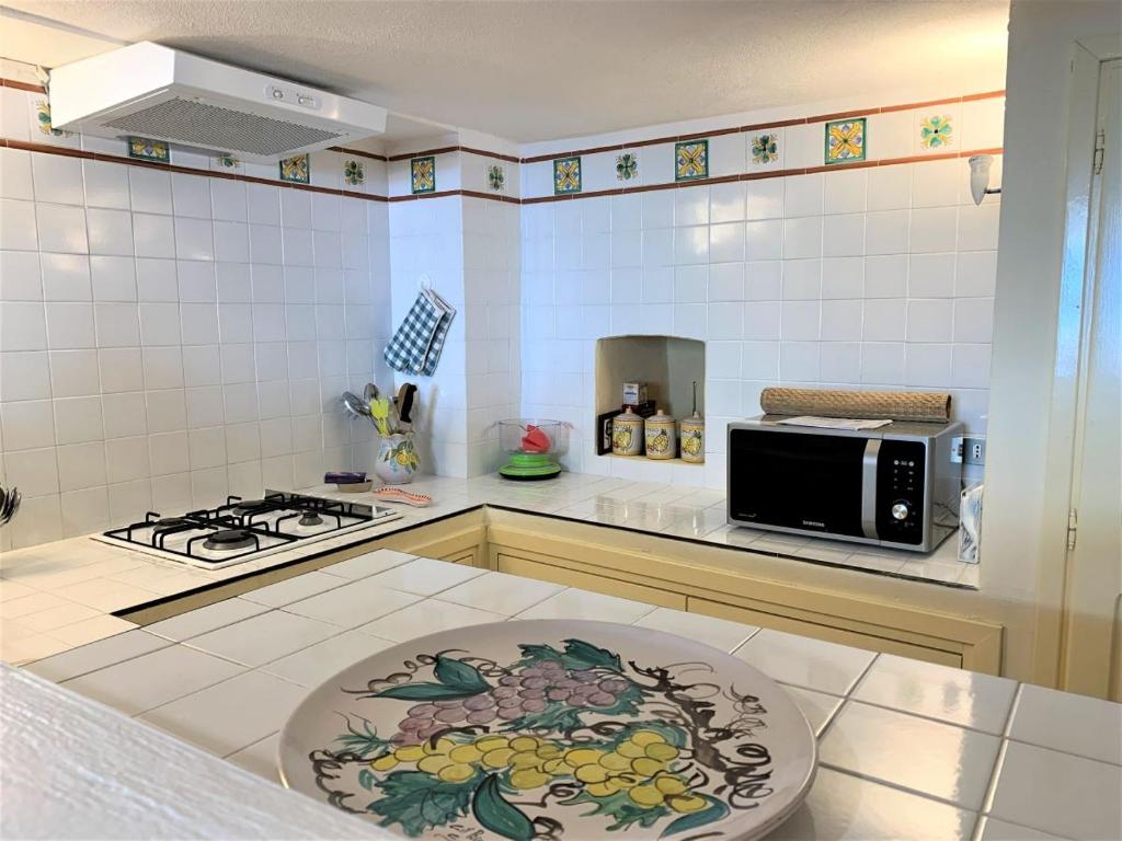 Kuchyň nebo kuchyňský kout v ubytování Casa Papuzza e Casa Lucilla