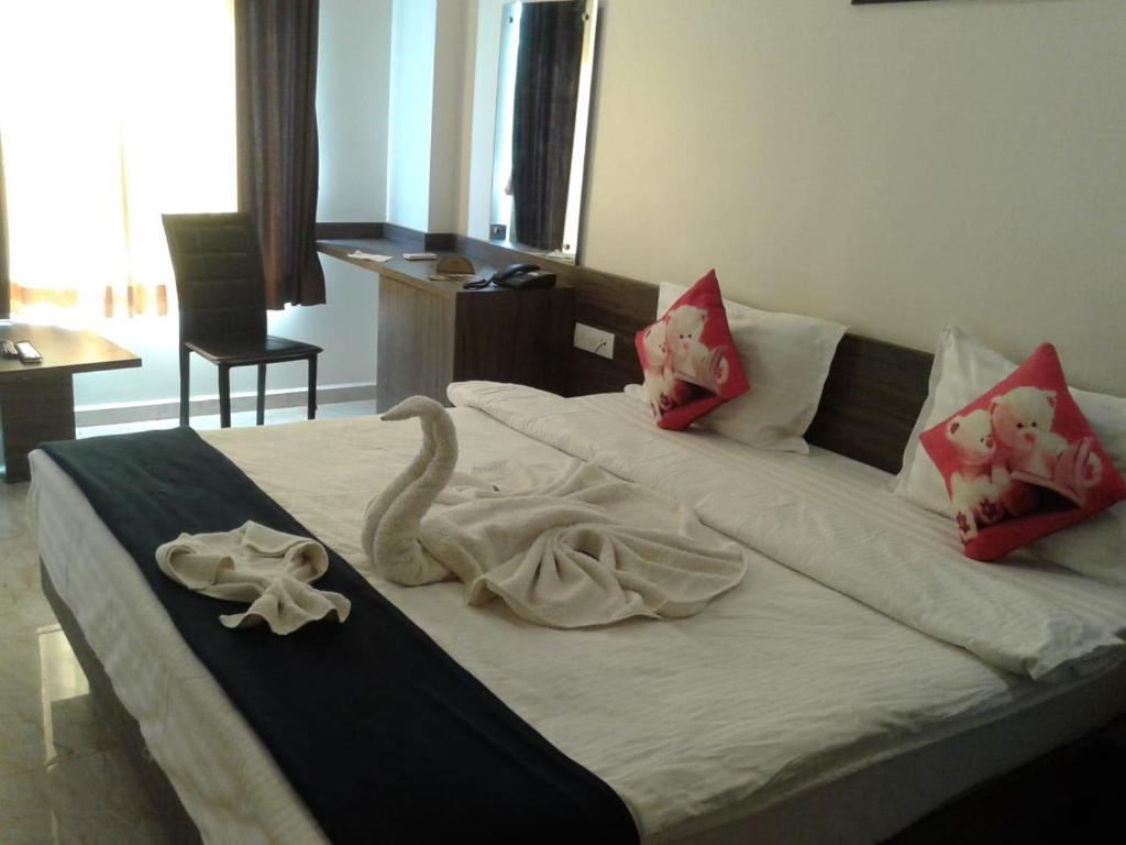 Postel nebo postele na pokoji v ubytování Hotel Gir Scintilla