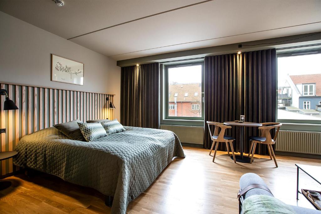 Postel nebo postele na pokoji v ubytování Hotel Britannia