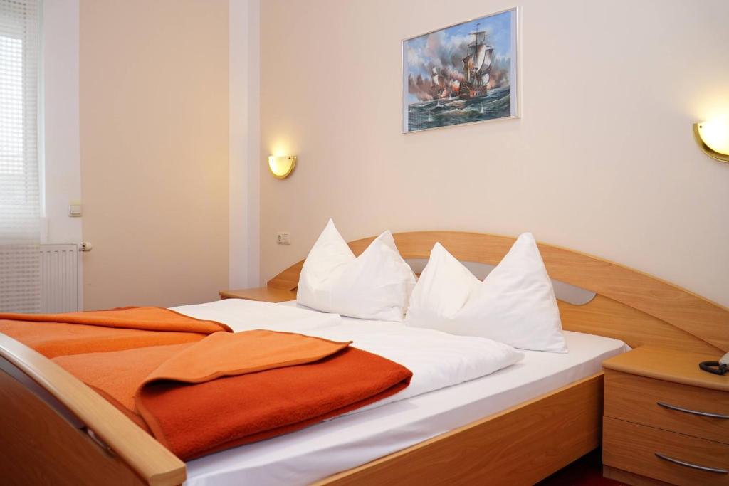 Postel nebo postele na pokoji v ubytování Hotel Hudelist