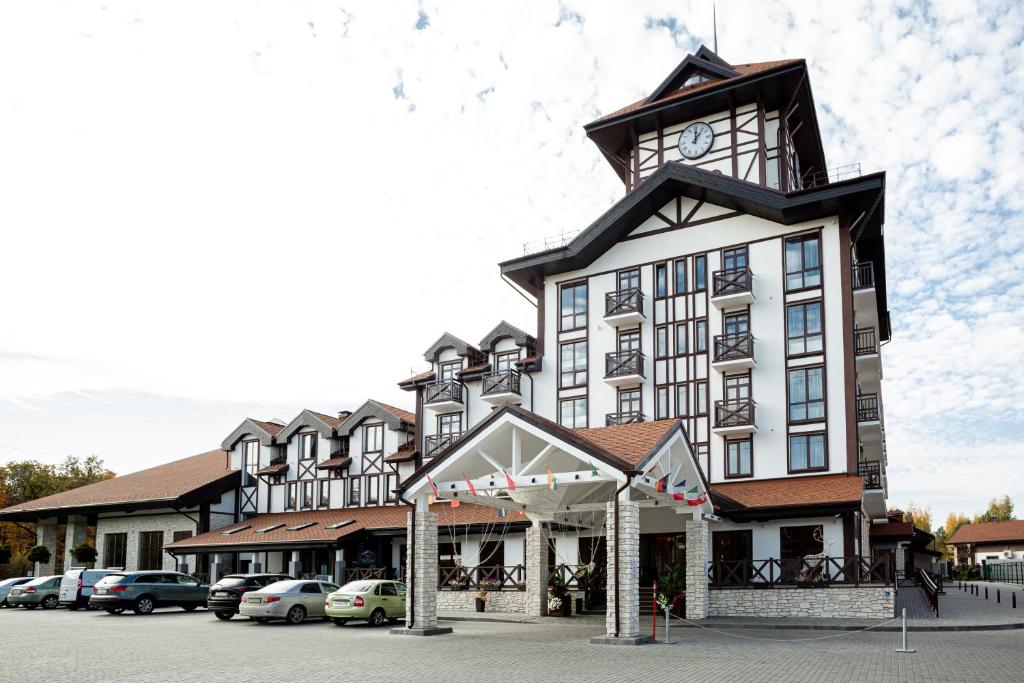 a large building with a clock tower on top of it at Alpen Park in Tolyatti