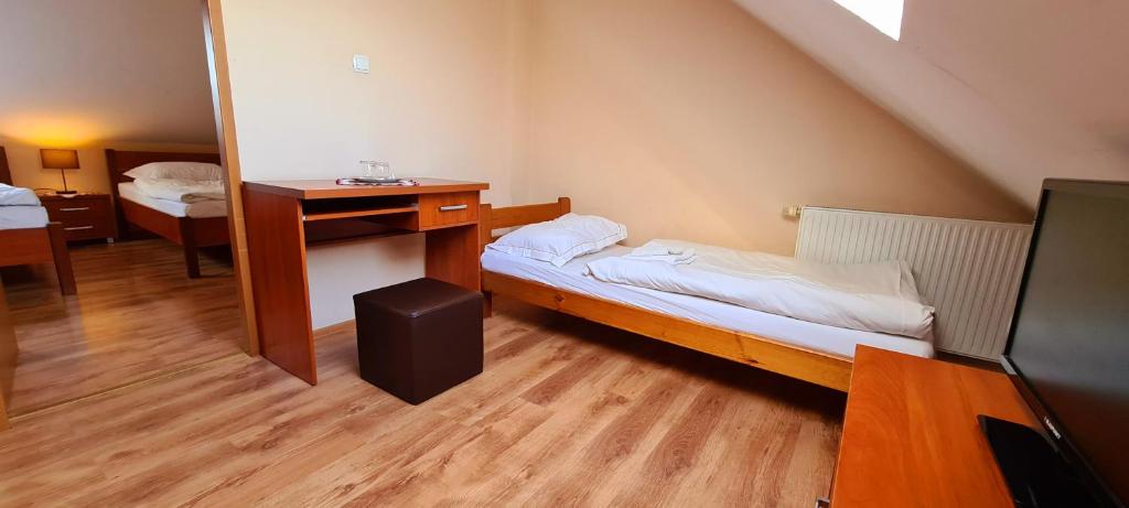 Postel nebo postele na pokoji v ubytování Zajazd Motel Staropolski