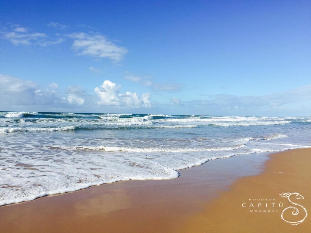 a view of the ocean from the beach at Pousada Capitù in Imbassai