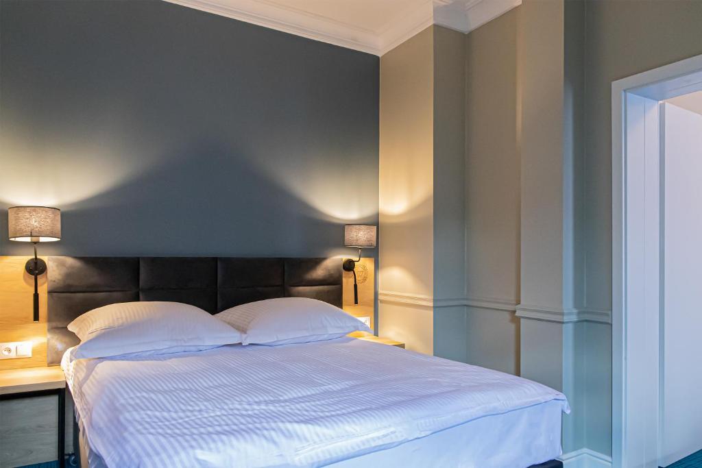 Postel nebo postele na pokoji v ubytování Hotel Wodnik