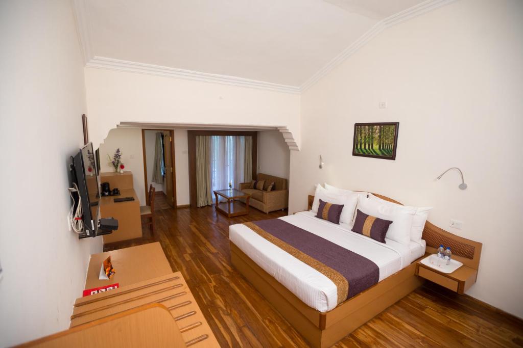 Postel nebo postele na pokoji v ubytování Hotel Kodai International