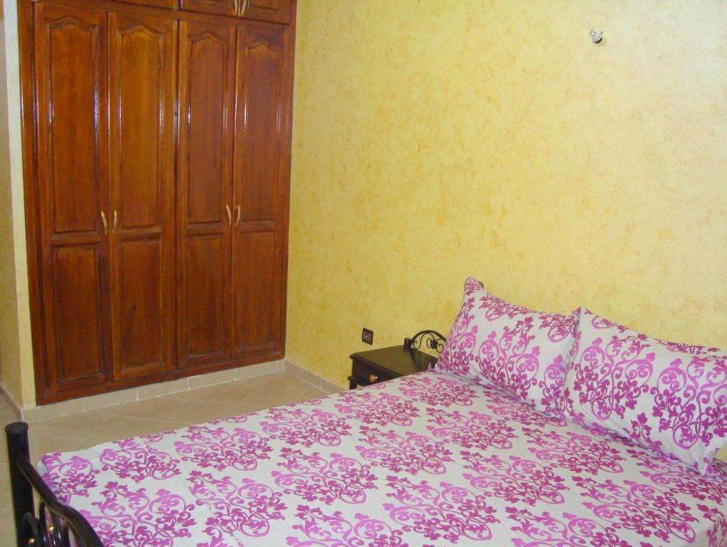 Postel nebo postele na pokoji v ubytování Yasmine Appartements