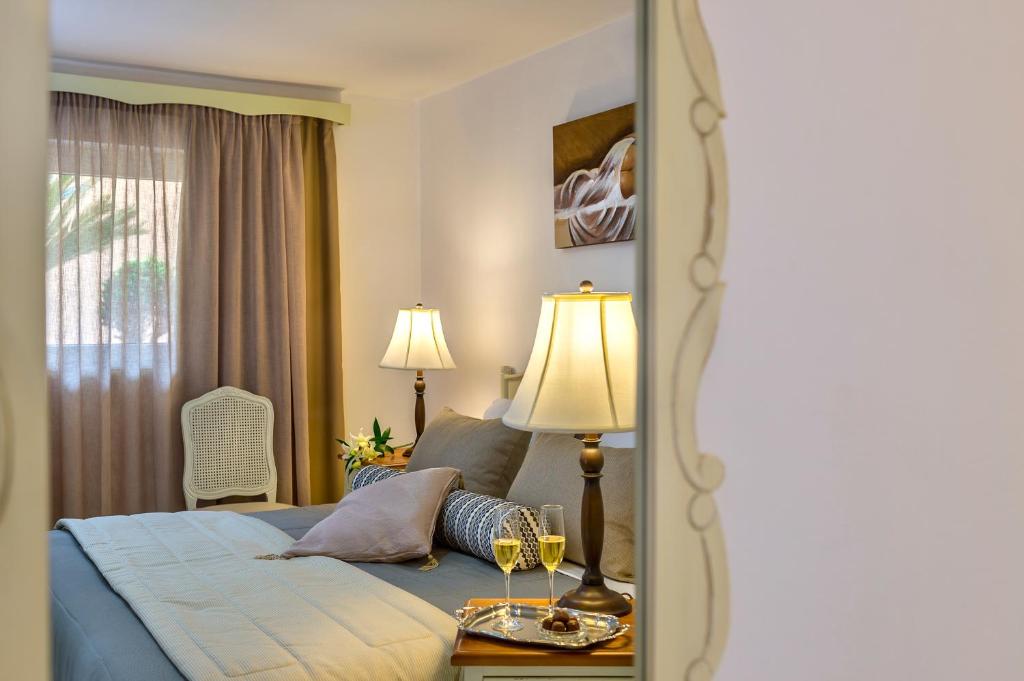 Postel nebo postele na pokoji v ubytování Agrimia Holiday Apartments