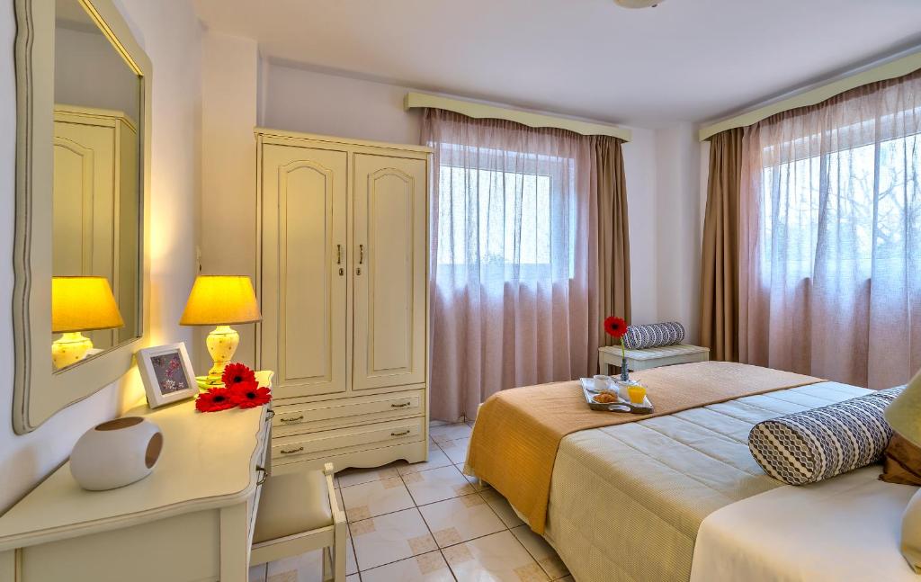 Postel nebo postele na pokoji v ubytování Agrimia Holiday Apartments