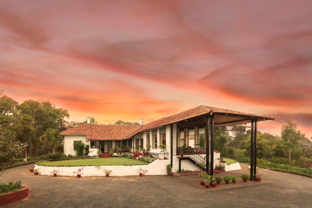 una representación de una casa con cenador en Ama Plantation Trails Coorg, en Gonikoppal