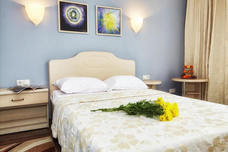 Postel nebo postele na pokoji v ubytování Hotel Chalpan