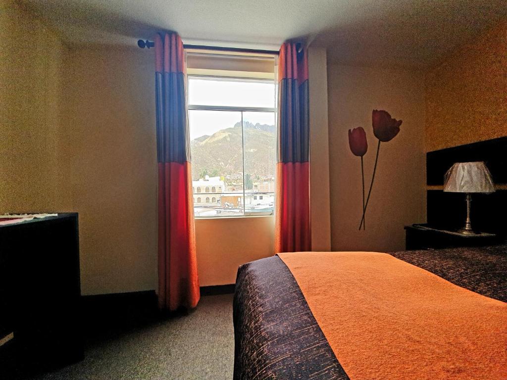 Postel nebo postele na pokoji v ubytování Vita Hoteles Colca
