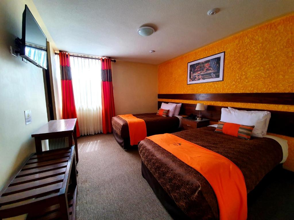 Postel nebo postele na pokoji v ubytování Vita Hoteles Colca