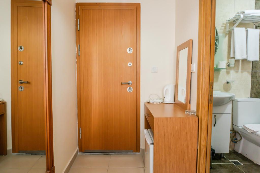 A bathroom at Camelot Apartment