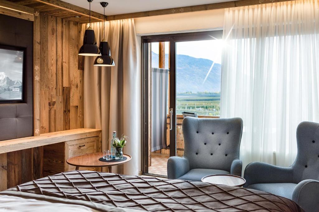 Posezení v ubytování MONDI Hotel Tscherms