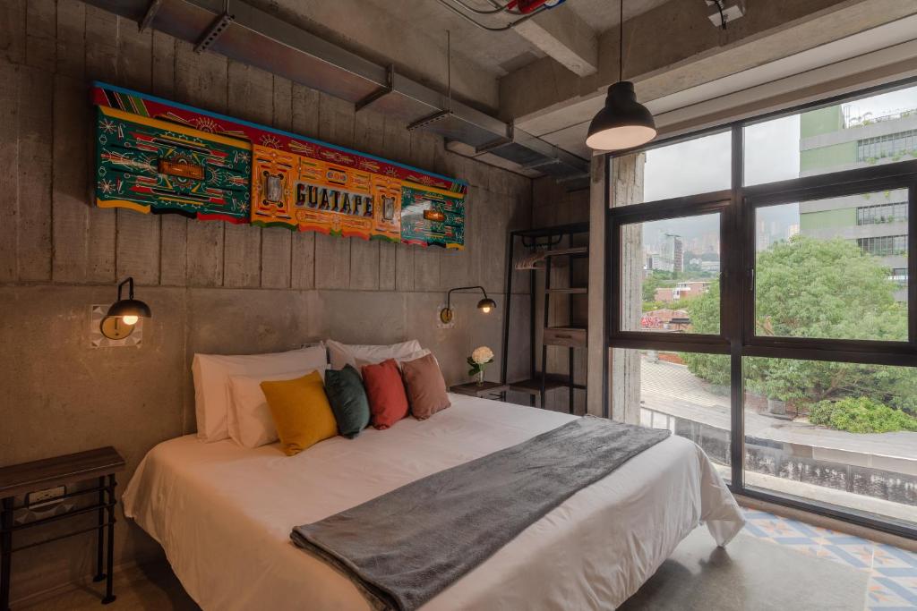 Postel nebo postele na pokoji v ubytování Masaya Medellin