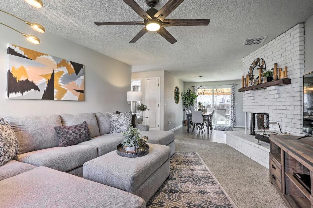 a living room with a couch and a fireplace at Duplex with Private Yard 3 Mi to Downtown Loveland! in Loveland