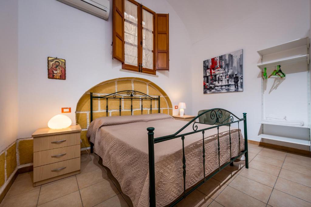 Łóżko lub łóżka w pokoju w obiekcie Casa Vacanze Cappuccini