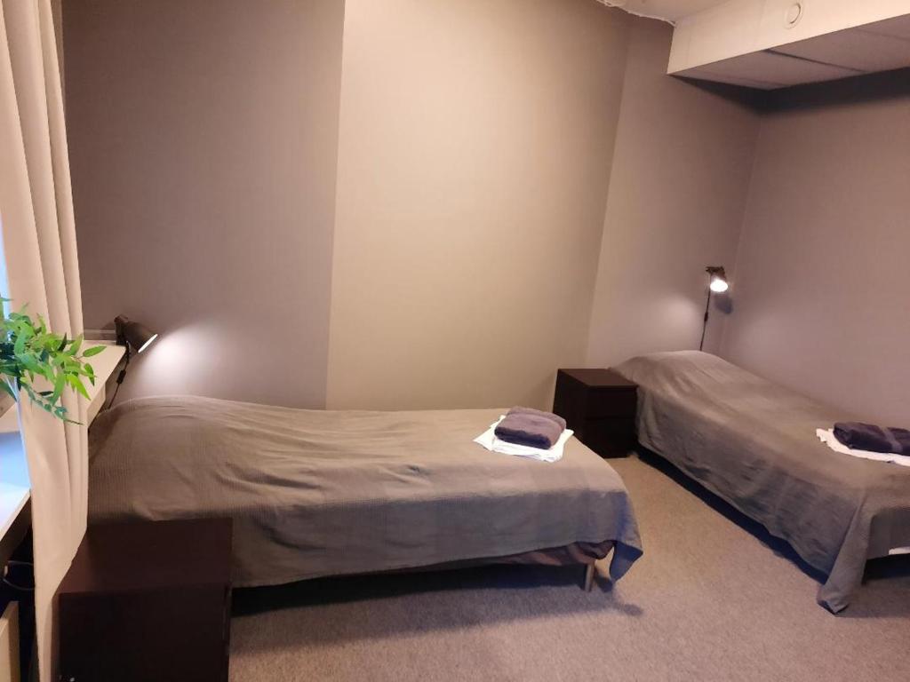 Säng eller sängar i ett rum på Vandrarhem Uppsala - Portalgatan