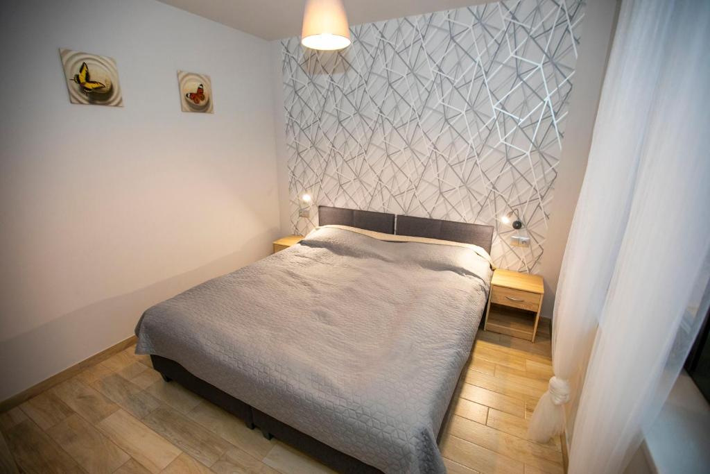Postel nebo postele na pokoji v ubytování Apartamenty PIER