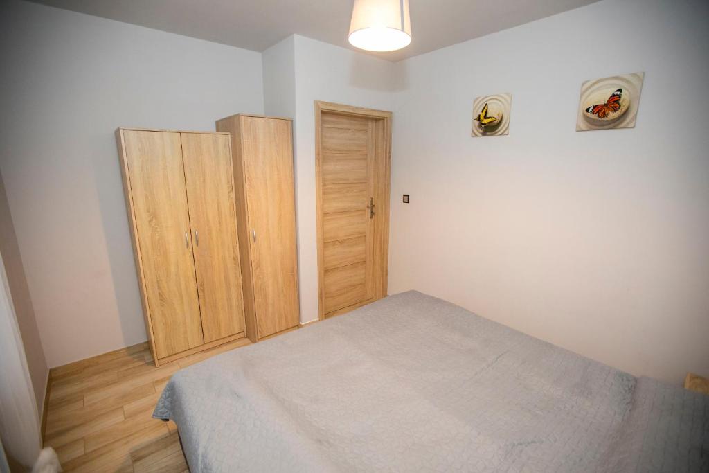 Postel nebo postele na pokoji v ubytování Apartamenty PIER