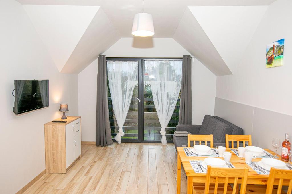 TV a/nebo společenská místnost v ubytování Apartamenty PIER