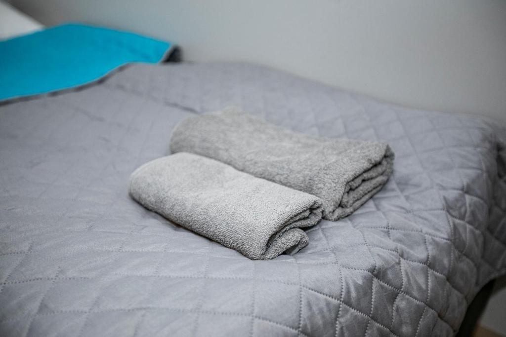 Postel nebo postele na pokoji v ubytování Apartamenty PIER