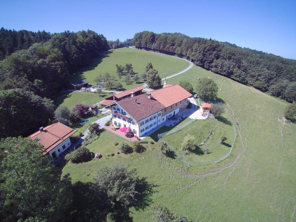an aerial view of a large house on a field at Taffenreutherhof in Achenmühle