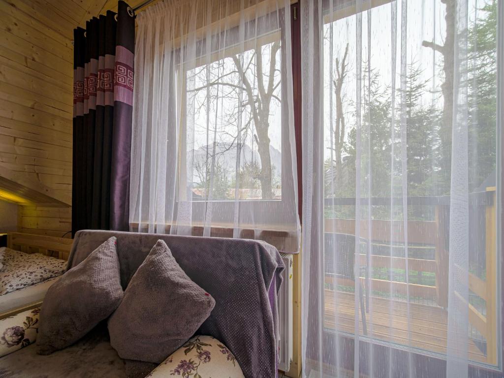 Posteľ alebo postele v izbe v ubytovaní JESIONKÓWKA - CENTRUM Zakopanego