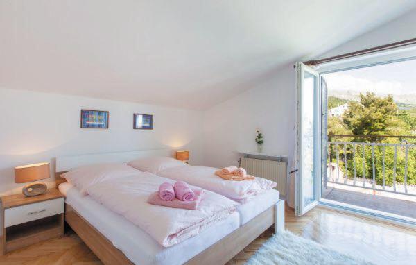 Posteľ alebo postele v izbe v ubytovaní Apartments MM