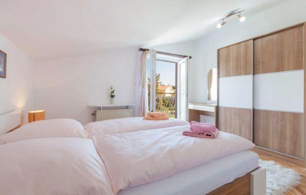 Posteľ alebo postele v izbe v ubytovaní Apartments MM