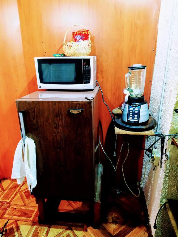 Kuchyň nebo kuchyňský kout v ubytování Hostal Latitud Ecuem