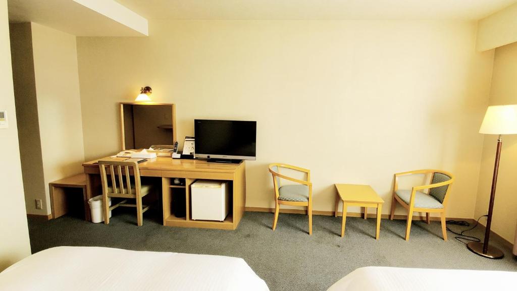 TV a/nebo společenská místnost v ubytování Island Hotel