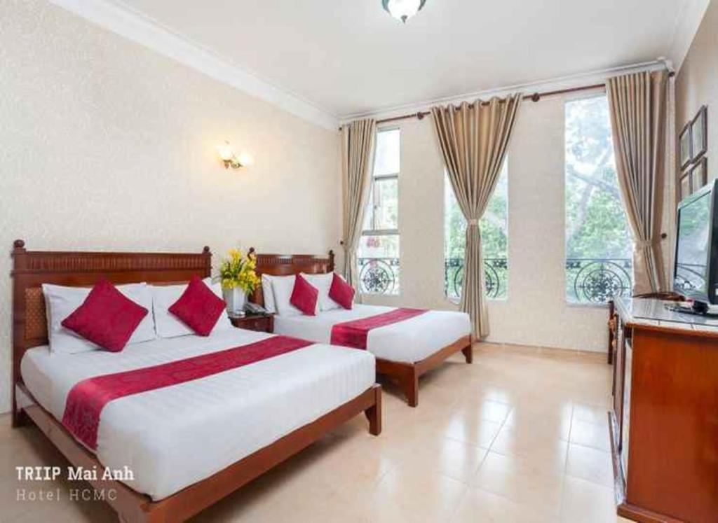 Giường trong phòng chung tại Mai Anh Hotel